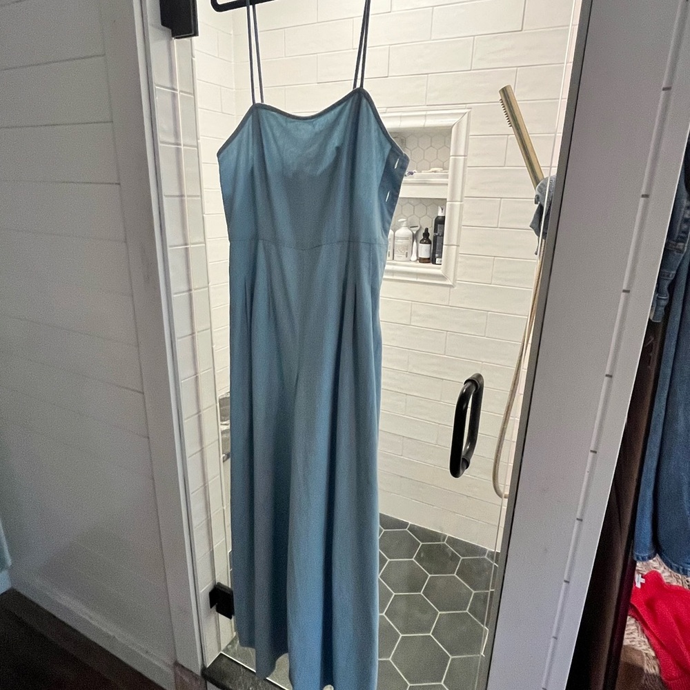 Blue jumpsuit with buttons